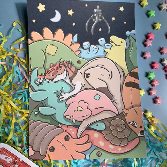 An art print of a sleepy Allosaurus, all cosy inside a claw machine full of plush prehistoric toys! There are little star bead props around the print.